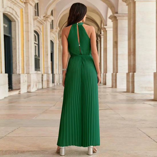 Pleated halter jumpsuit, fluid and composed